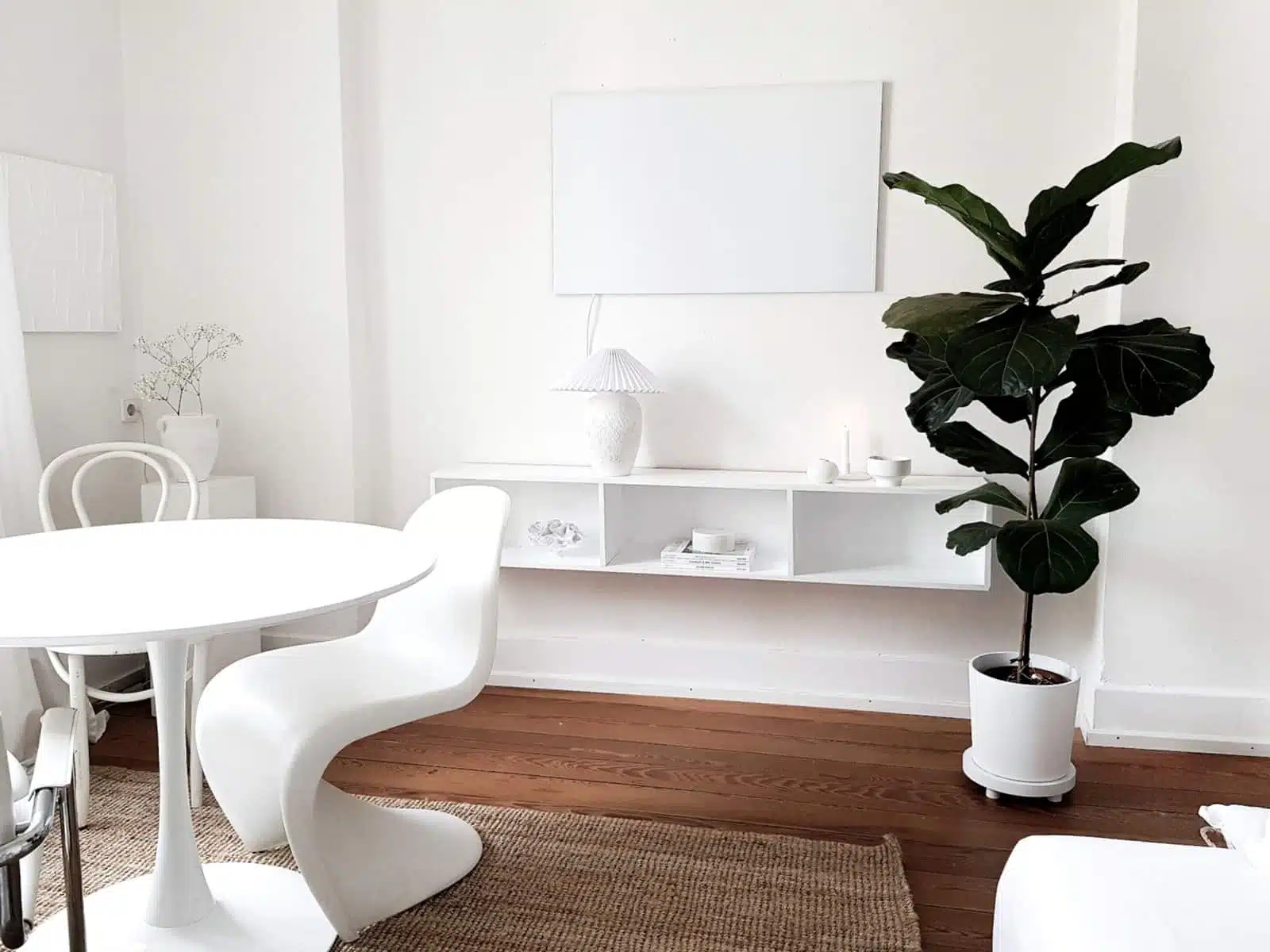 A white infrared heater on a white wall.
